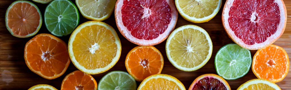 Site Banner Image showing some citrus fruits like oranges showing a palette of colour inside them